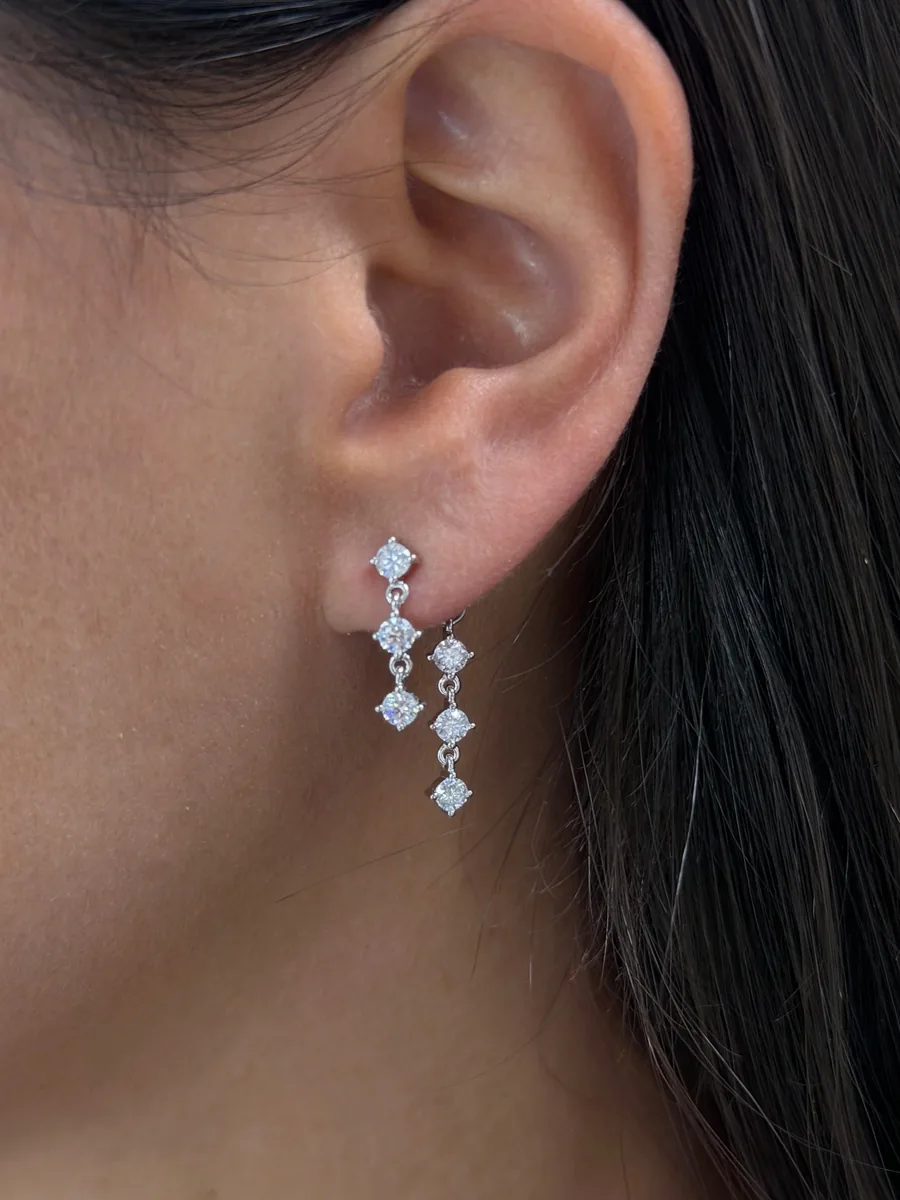 Drop chain earrings worn