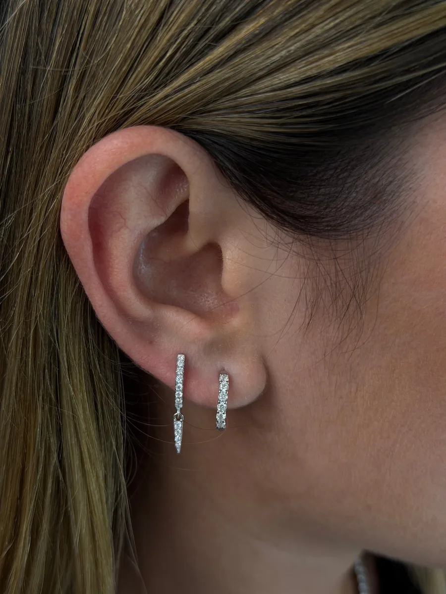 Edge drop hoop earrings worn
