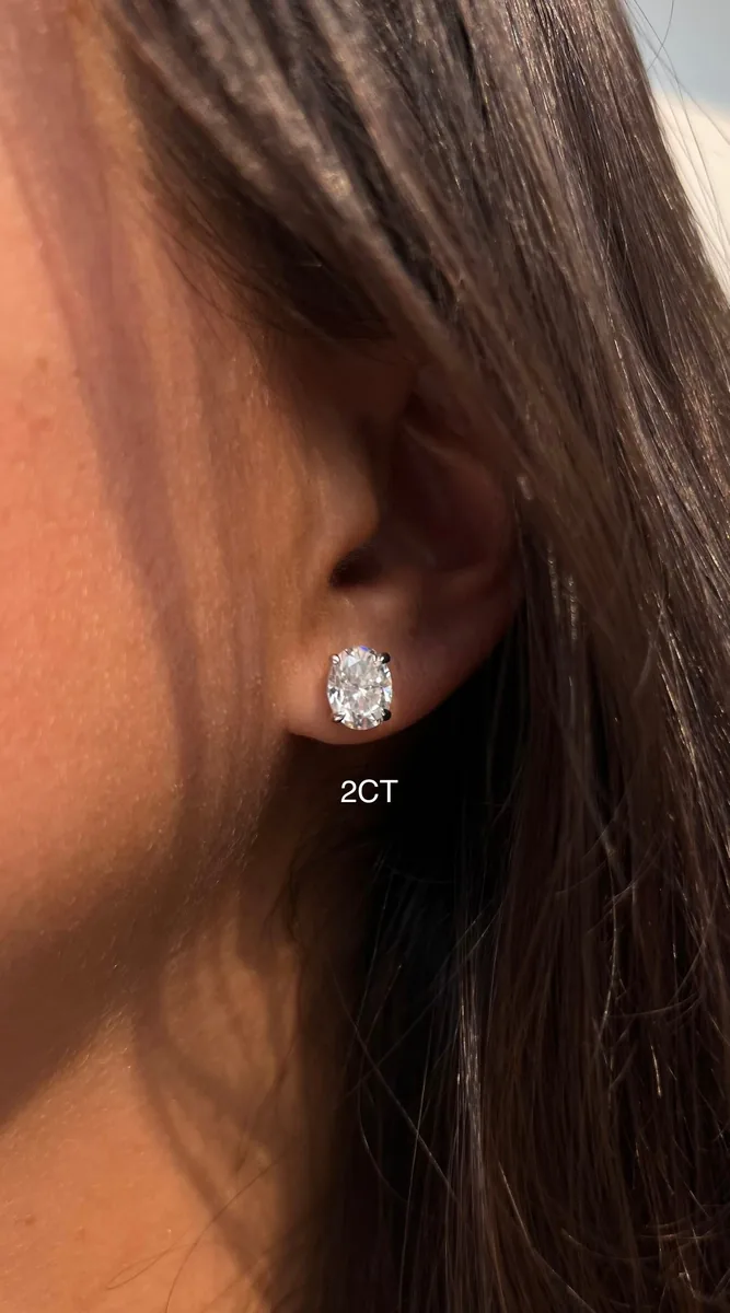 Oval Cut Solitaire Stud Earrings worn