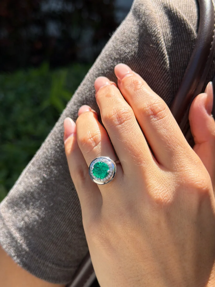 Round Emerald Halo Ring worn